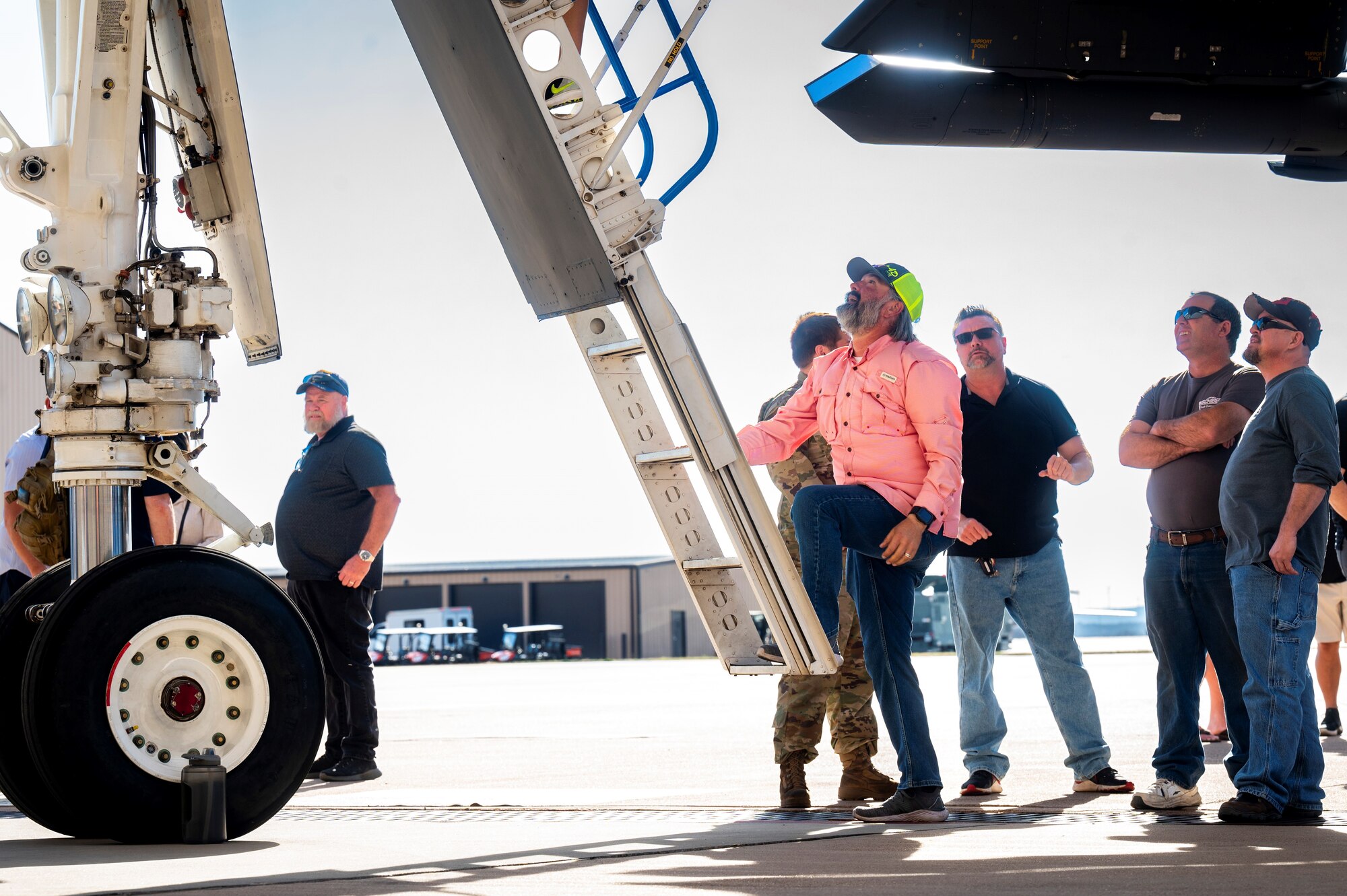 A retired U.S. Air Force maintainer climbs a ladder to enter the flightdeck of a B-1B Lancer during a maintainer reunion at Dyess Air Force Base, Texas, Feb. 24, 2024. During the reunion, attendees got an up-close look at a B-1B Lancer, received a mission brief and a Boeing presentation. In attendance were former maintainers of the B-1, along with their families. (U.S. Air Force photo by Senior Airman Leon Redfern)