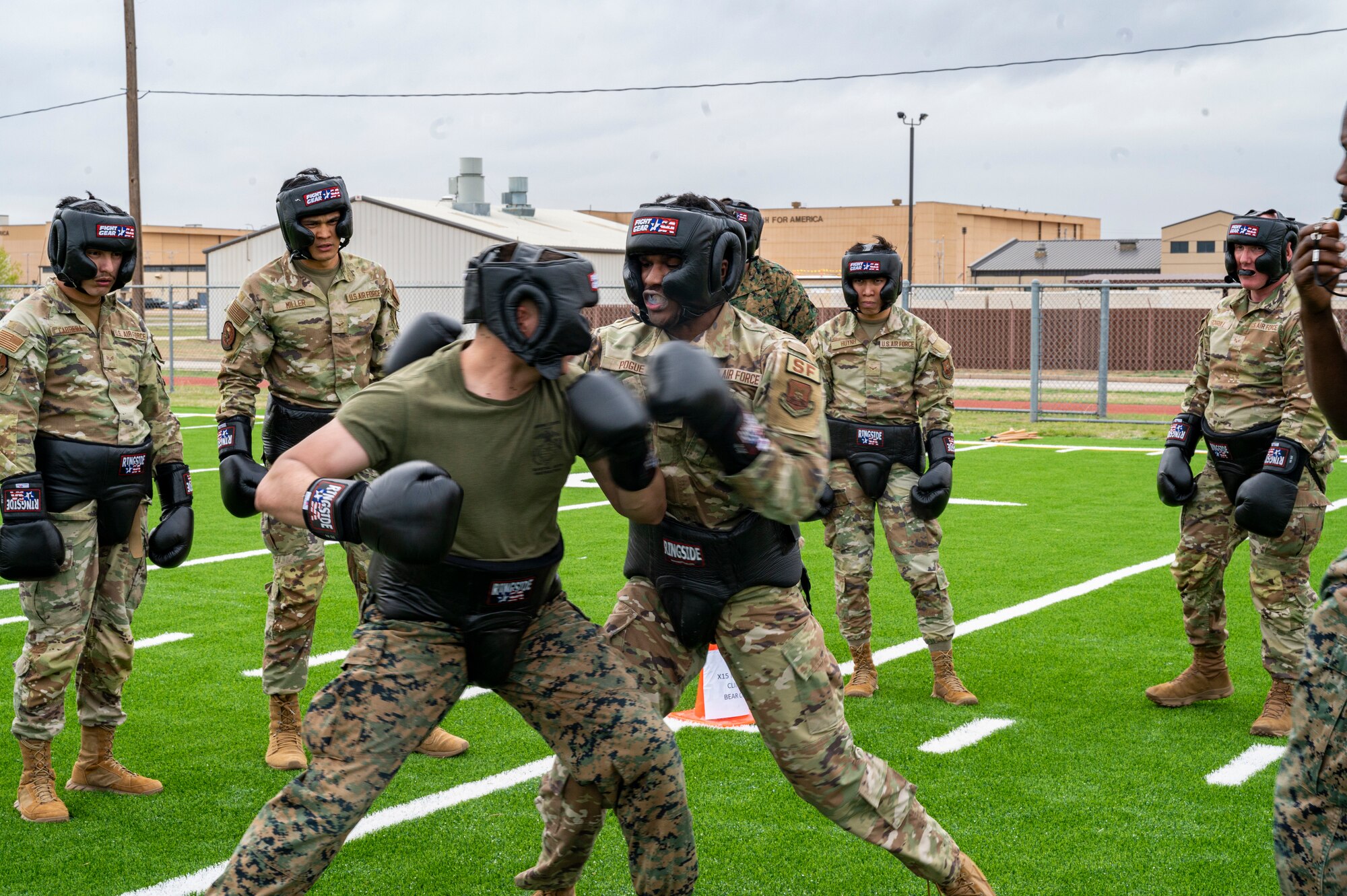 Dyess Airmen and Marines spar during a Marine Corps Martial Arts Program class at Dyess Air Force Base, Texas, Feb. 27, 2024. MCMAP, originally created by the U.S. Marine Corps in 2001, is designed to combine existing and new hand-to-hand and close quarters combat techniques with morale and team-building functions. The program includes unarmed combat, edged weapons, weapons of opportunity and rifle and bayonet techniques. (U.S. Air Force photo by Airman 1st Class Alondra Cristobal Hernandez)