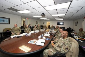 Chief Master Sgt. Johnny Harris listens to a briefing.