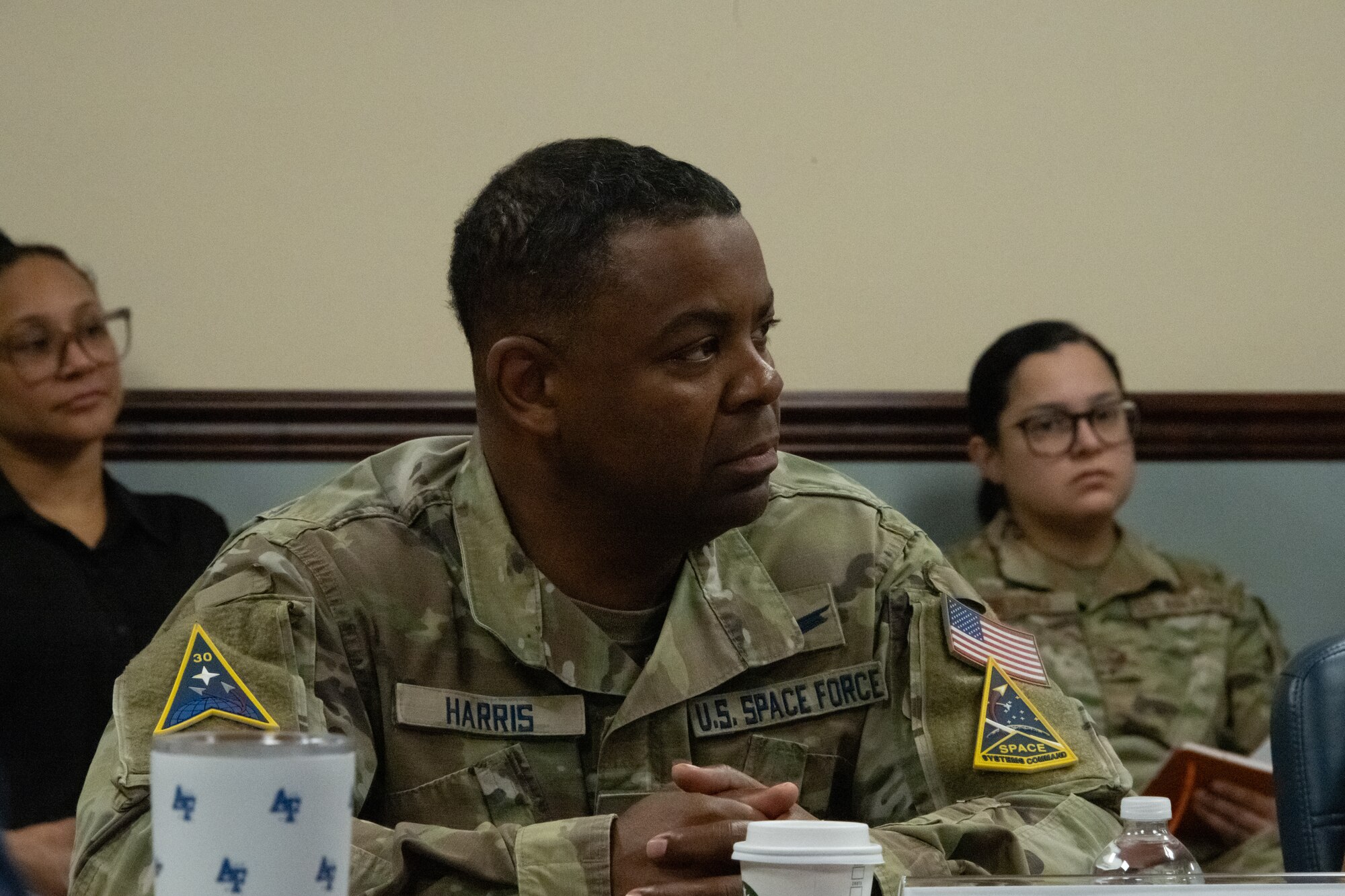 Chief Master Sgt. Johnny Harris listens to a briefing.