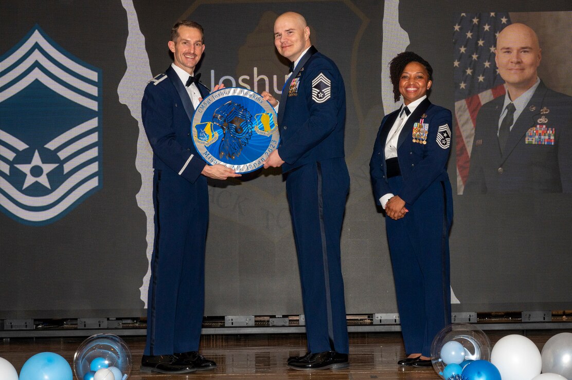 U.S. Air Force Chief Master Sgt. Joshua Hawkins, 35th Maintenance Group ammo production section chief, is given a recognition plaque during a Chief Master Sergeant Recognition Ceremony at Misawa Air Base, Japan, March 9, 2024.