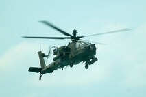 A U.S. Army AH-64 Apache helicopter provides close air support to forces on the beach during an amphibious assault on Hat Yao Beach at Exercise Cobra Gold, Rayong Province, Thailand, March 1, 2024. Joint Exercise Cobra Gold is the largest joint exercise in mainland Asia and a concrete example of the strong alliance and strategic relationship between Thailand and the United States. This year is the 43rd iteration of the multilateral exercise which occurs between Feb. 27 to March 8, 2024. (U.S. Marine Corps photo by Cpl. Emily Weiss)