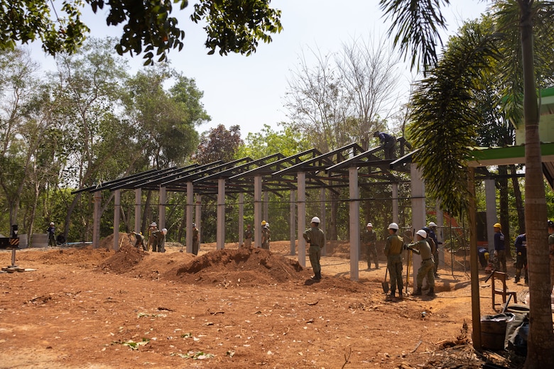 U.S. Marines with Marine Wing Support Squadron (MWSS) 171, Marine Aircraft Group 12, Royal Thai marines with the Royal Thai Marine Corps Construction Company of Combat Engineers, and members of the Singapore Army with the 30th Combat Engineer Brigade prepare the construction site to lay groundwork at the Ban Prakaet school in Chanthaburi, Thailand, Feb. 14, 2024. Marines of MWSS-171 lent their engineering expertise to multilateral humanitarian efforts during Cobra Gold 24. Joint Exercise Cobra Gold is the largest joint exercise in mainland Asia and a concrete example of the strong alliance and strategic relationship between Thailand and the United States. This year will be the 43rd iteration of the multilateral exercise and will be held from Feb. 27 to March 8, 2024. (U.S. Marine Corps Photo by Cpl. Calah Thompson)