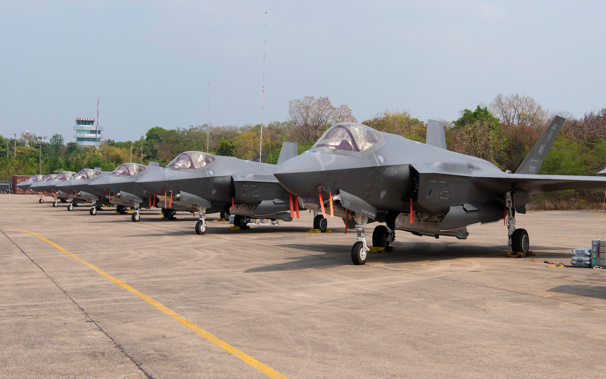 F-35A Lightning II’s assigned to the 354th Fighter Wing, Eielson Air Force Base, Alaska, sit on a runway prior to Exercise Cope Tiger 2024 at Korat Royal Thai Air Force Base, Thailand, March 7, 2024. This marks the first time in its 28th iteration of the exercise that 5th generation aircrafts are used in the Cope Tiger exercise. Units from the United States, Kingdom of Thailand and the Republic of Singapore Air Force have partnered together in this trilateral training to address regional security threats, humanitarian crises, and natural disasters. (U.S. Air Force Senior Airman Joao Marcus Costa)