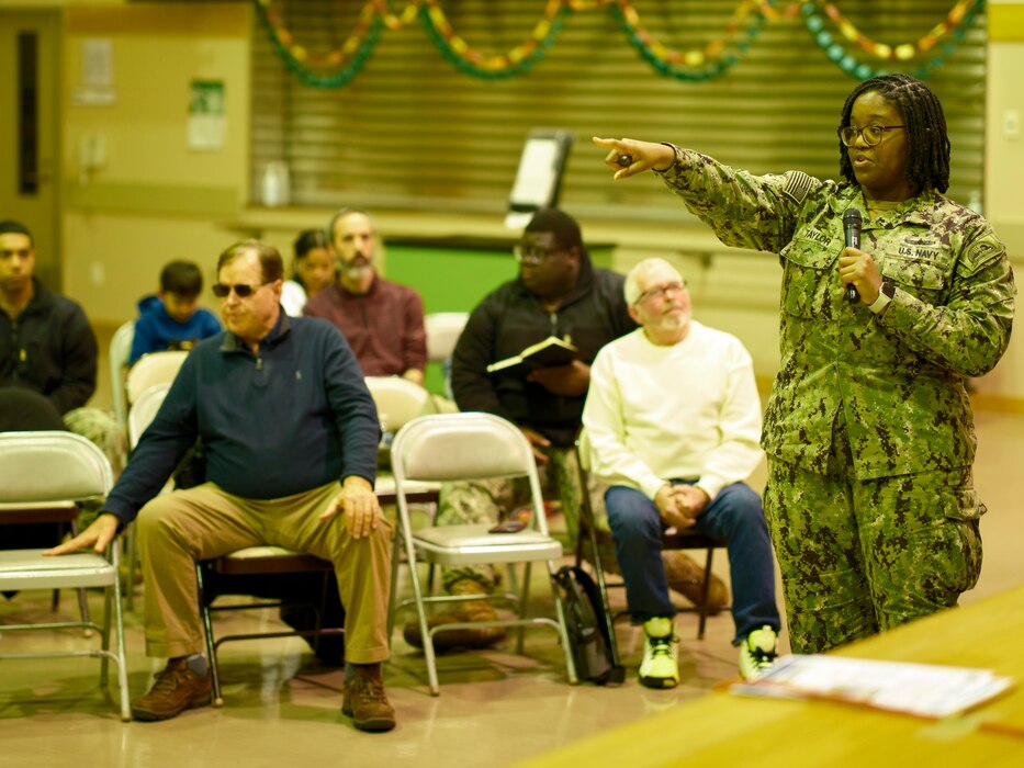 Ikego Detachment officer-in-charge, briefs the Ikego community at the Ikego Detachment Town Hall for 1st Quarter March 7, 2024 at Ikego Elementary School in Zushi, Japan.