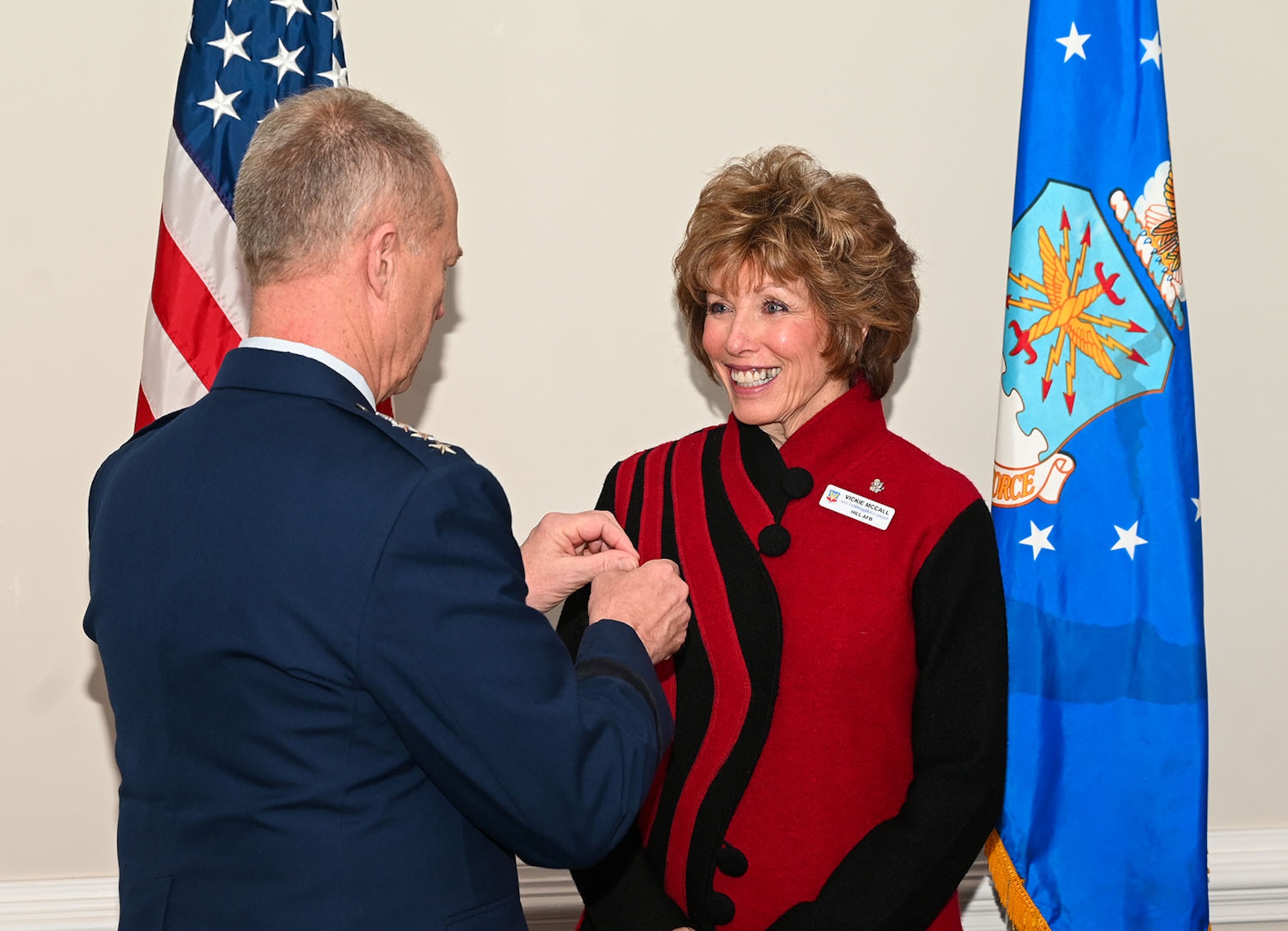Gen. Mark Kelly presents Vickie McCall (center) and Dr. Lucy Greene (right) the Commander’s Public Service Award.