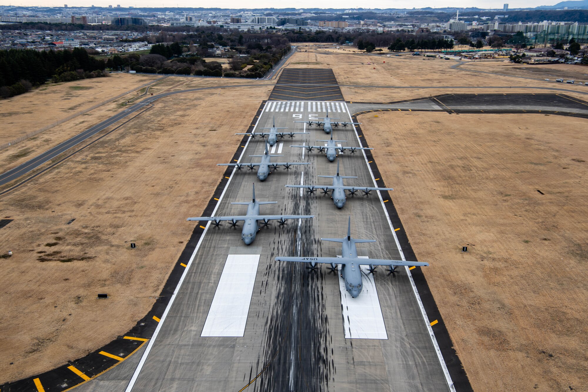 Seven U.S. Air Force C-130J Super Hercules aircraft assigned to the 36th Airlift Squadron participate in an elephant walk.