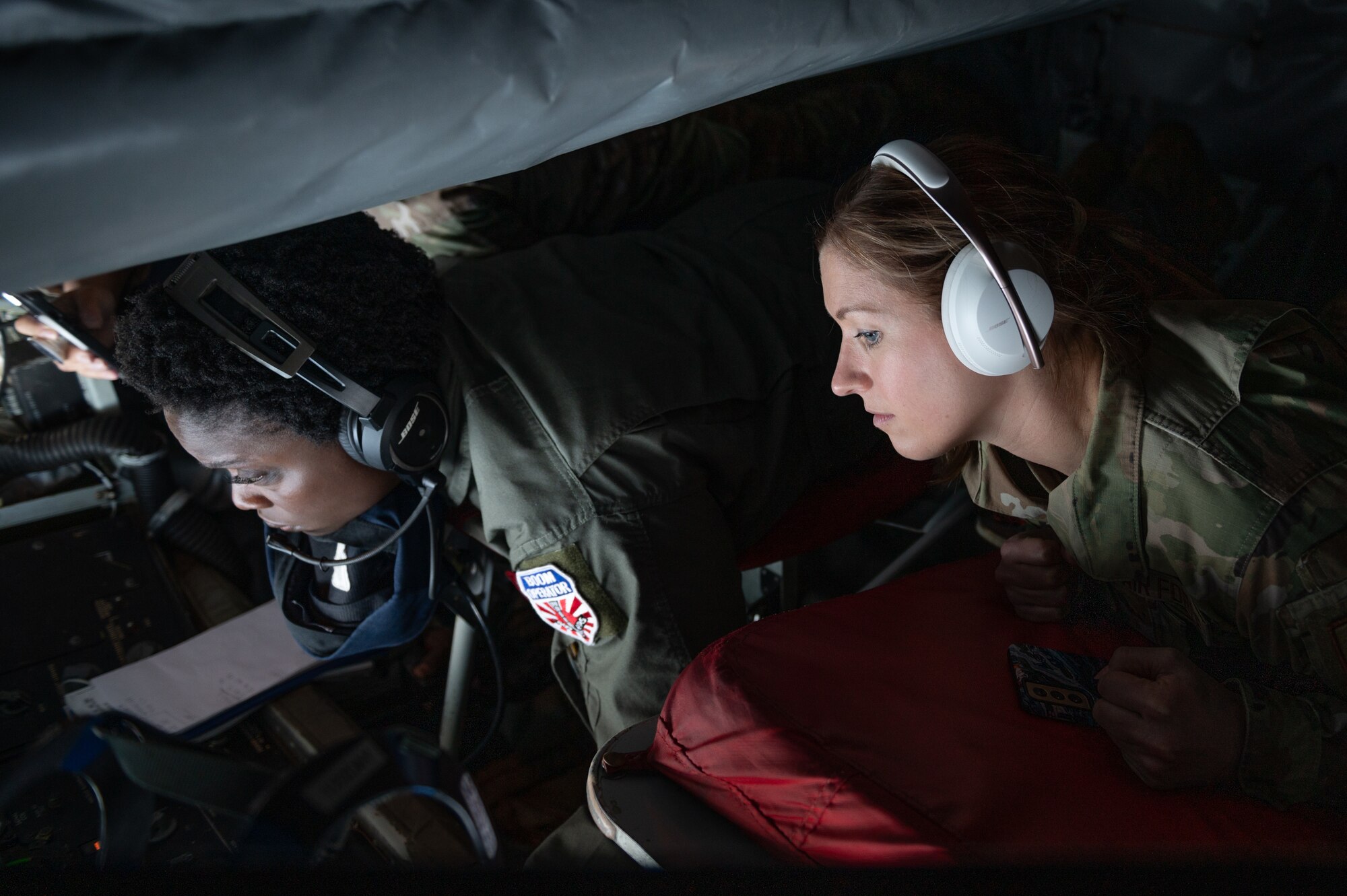 Airman lay in the boom pod of a KC-135 Stratotanker