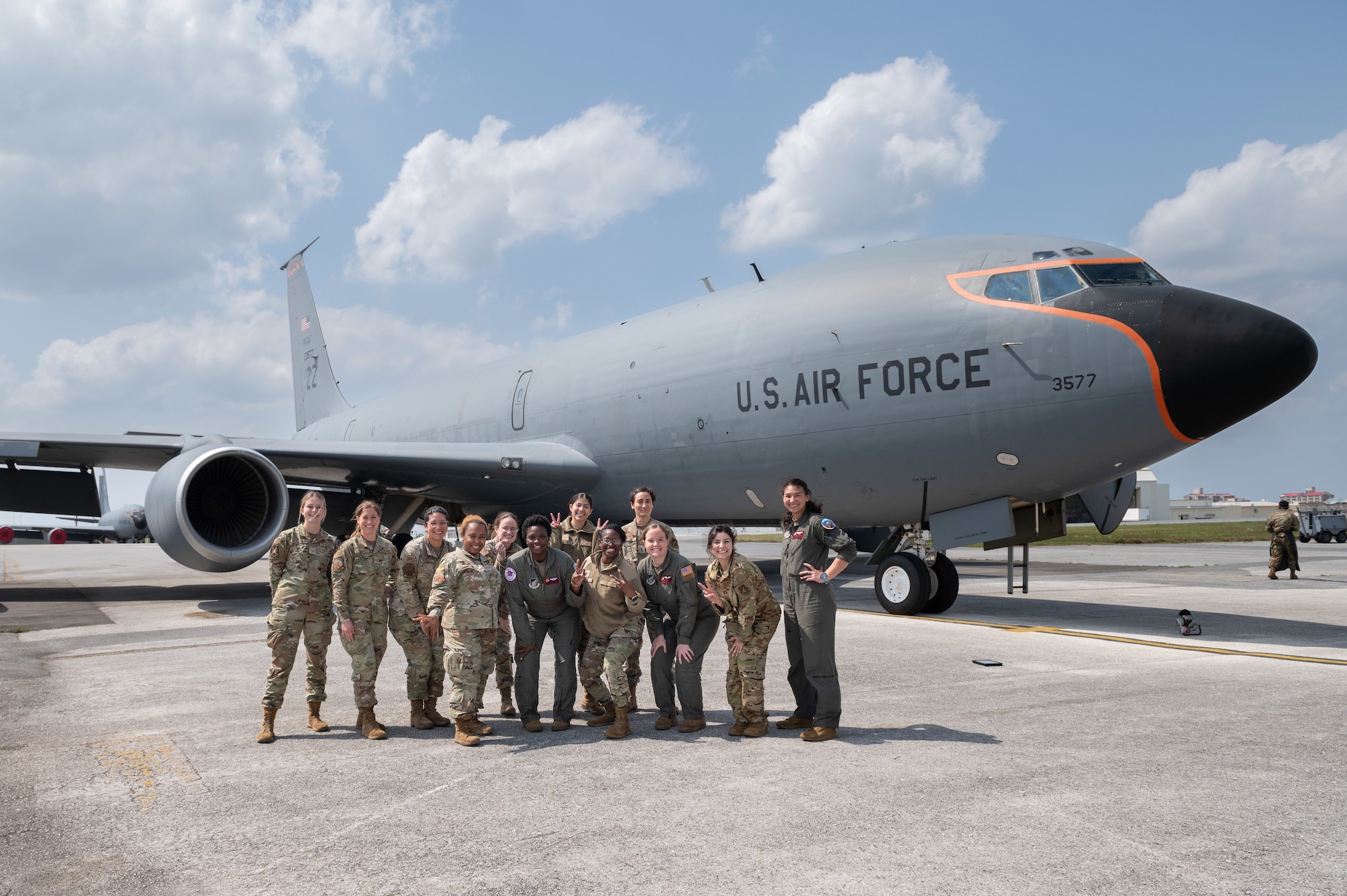 Female airmen pose for a group photo in front of a KC-135 Stratotanker
