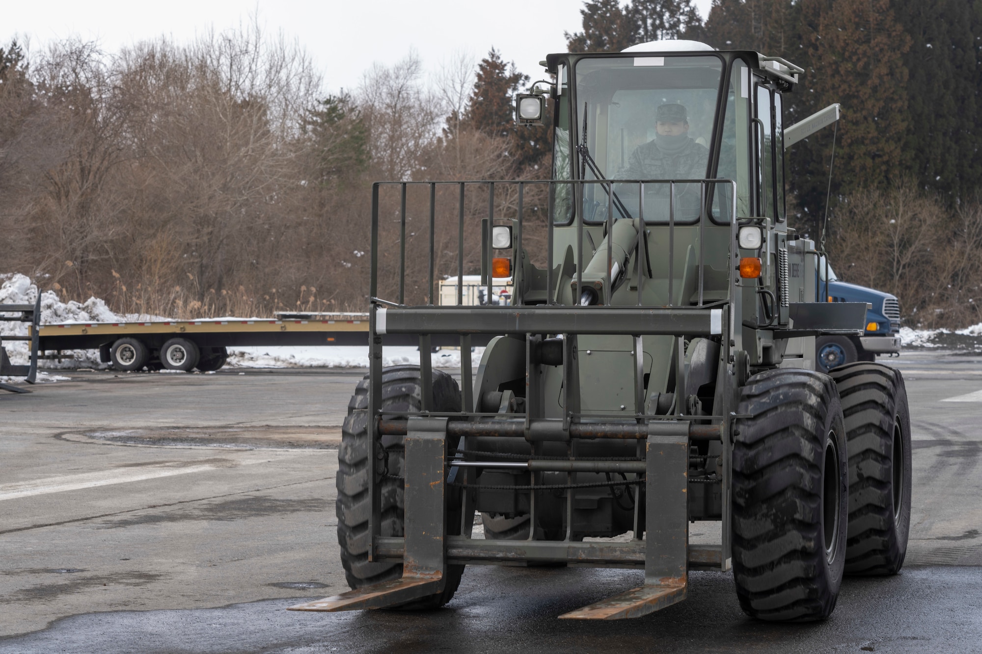 A Japan Air Self-Defense Force (JASDF) Airman operates a forklift during a Multi-Capable Airman course at Misawa Air Base, Japan, March 7, 2024.