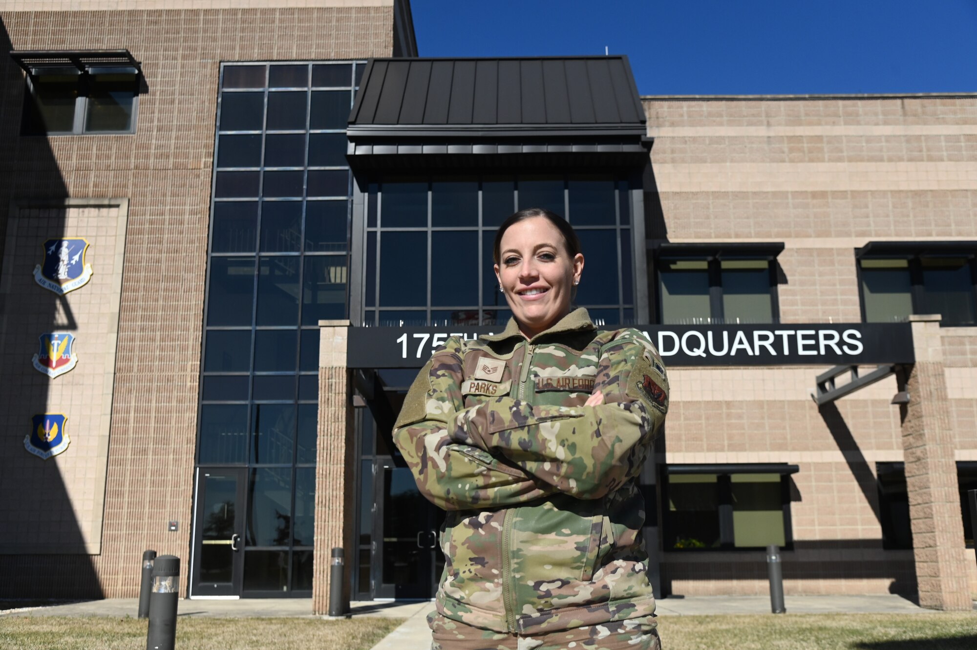 U.S. Air National Guard Staff Sgt. Brooke Parks, 175th Force Support Squadron recruiter, poses for a photo in front of the 175th Wing Headquarters building at Martin State Air National Guard Base, Maryland, Feb. 4, 2024.