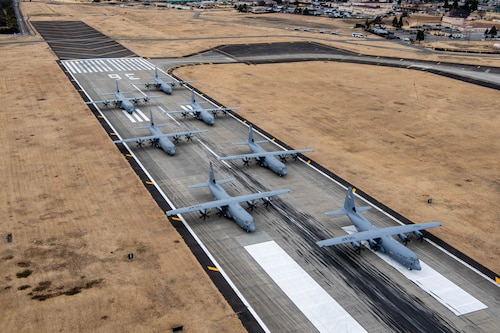 Seven U.S. Air Force C-130J Super Hercules aircraft assigned to the 36th Airlift Squadron participate in an elephant walk.