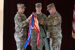 Lt. Col. Carlos Maldonado, the commander of the 529th Combat Sustainment Support Battalion, and Command Sgt. Maj. David Elliot, the battalion's senior enlisted advisor, uncase their unit colors during a transfer of authority ceremony in Powidz, Poland, March 11, 2024. The 529th CSSB and outgoing 787th CSSB are among a multi-compositional array of units within 3rd Division Sustainment Brigade, 3rd Infantry Division working alongside NATO allies and regional security partners to provide combat-credible forces to V Corps, America’s forward deployed corps in Europe. Maldonado and Elliot uncased their unit colors and Lt. Col. Jeoffrey Hall and Command Sgt. Maj. Clint Halstead, the 787th CSSB command team, cased theirs, symbolically demonstrating the formal transfer of responsibility for the mission from one another. Col. Jennifer McDonough, the commander of the 3rd DSB, congratulated the outgoing team for completing a challenging mission and welcomed the incoming team as the reviewing officer of the ceremony. The 787th CSSB is based in Dothan, Alabama, and the 529th CSSB deployed from Virginia Beach, Virginia.