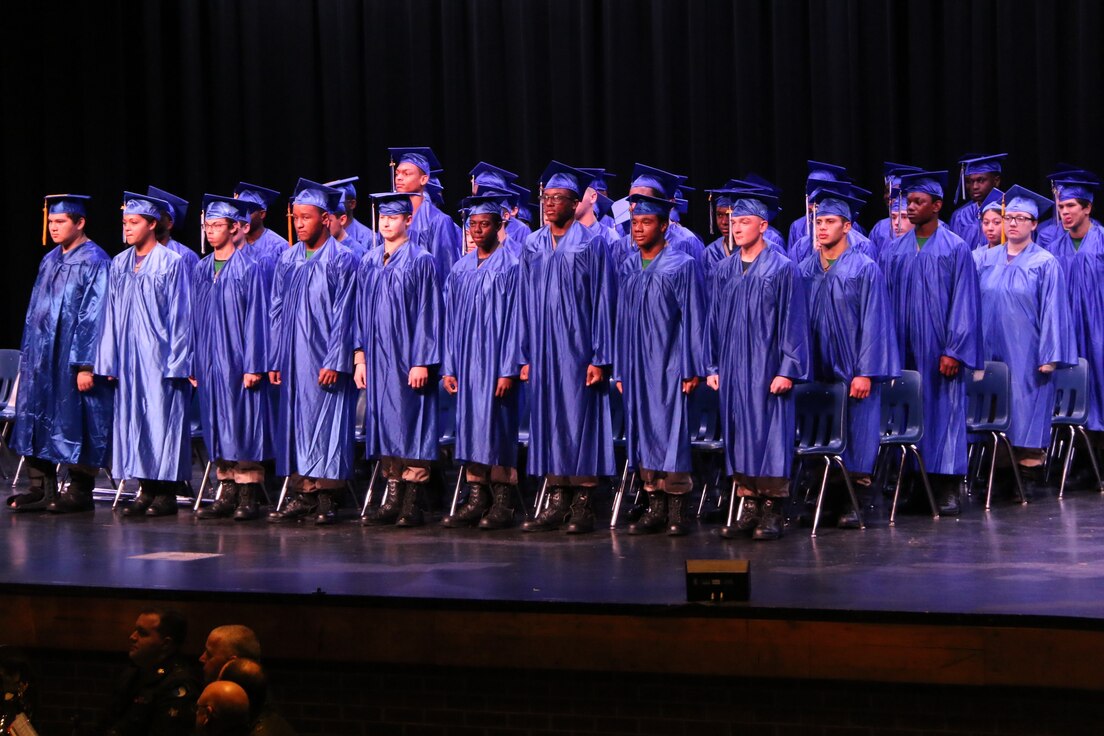 Graduates standing on stage