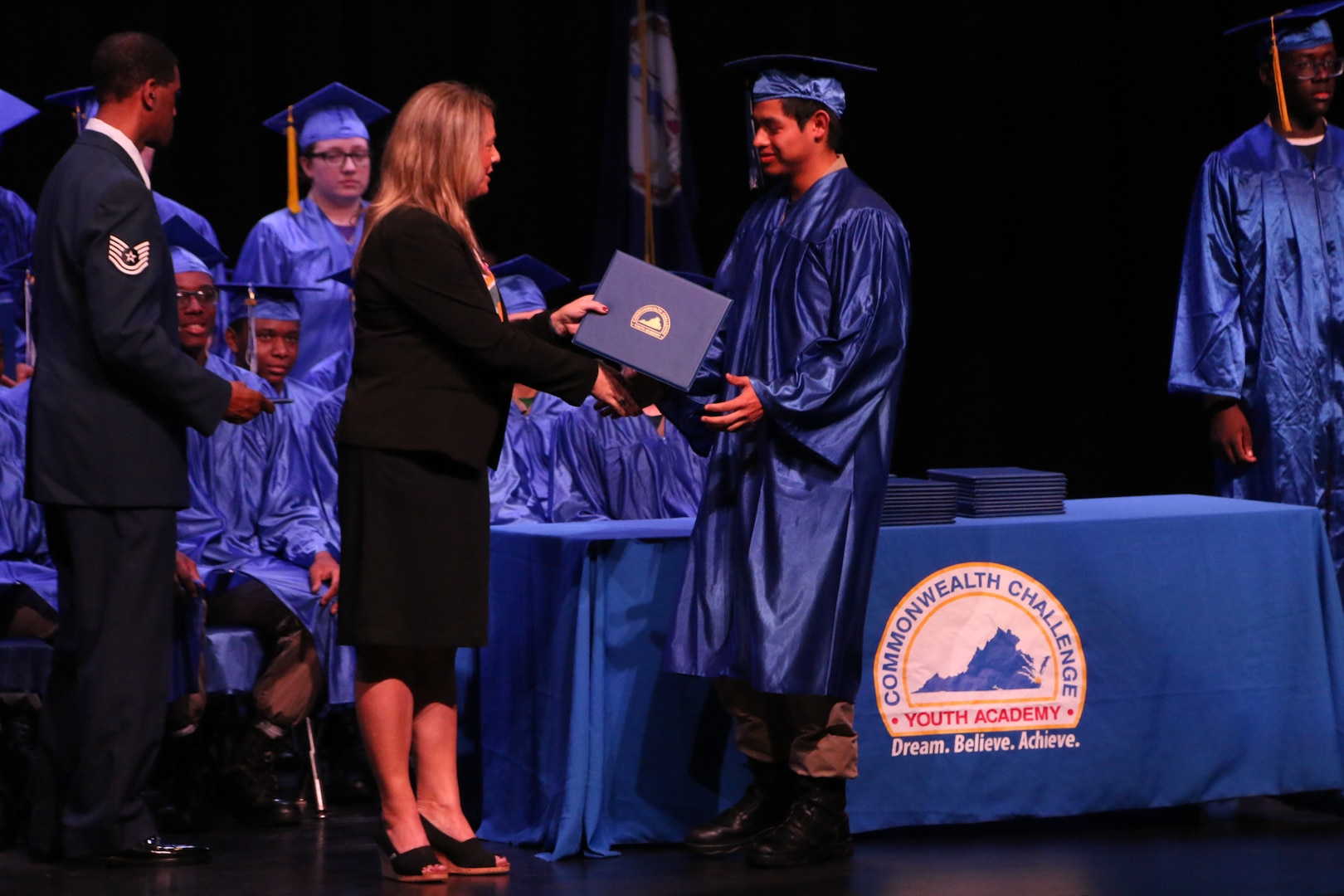 Cadet receiving certificate on stage