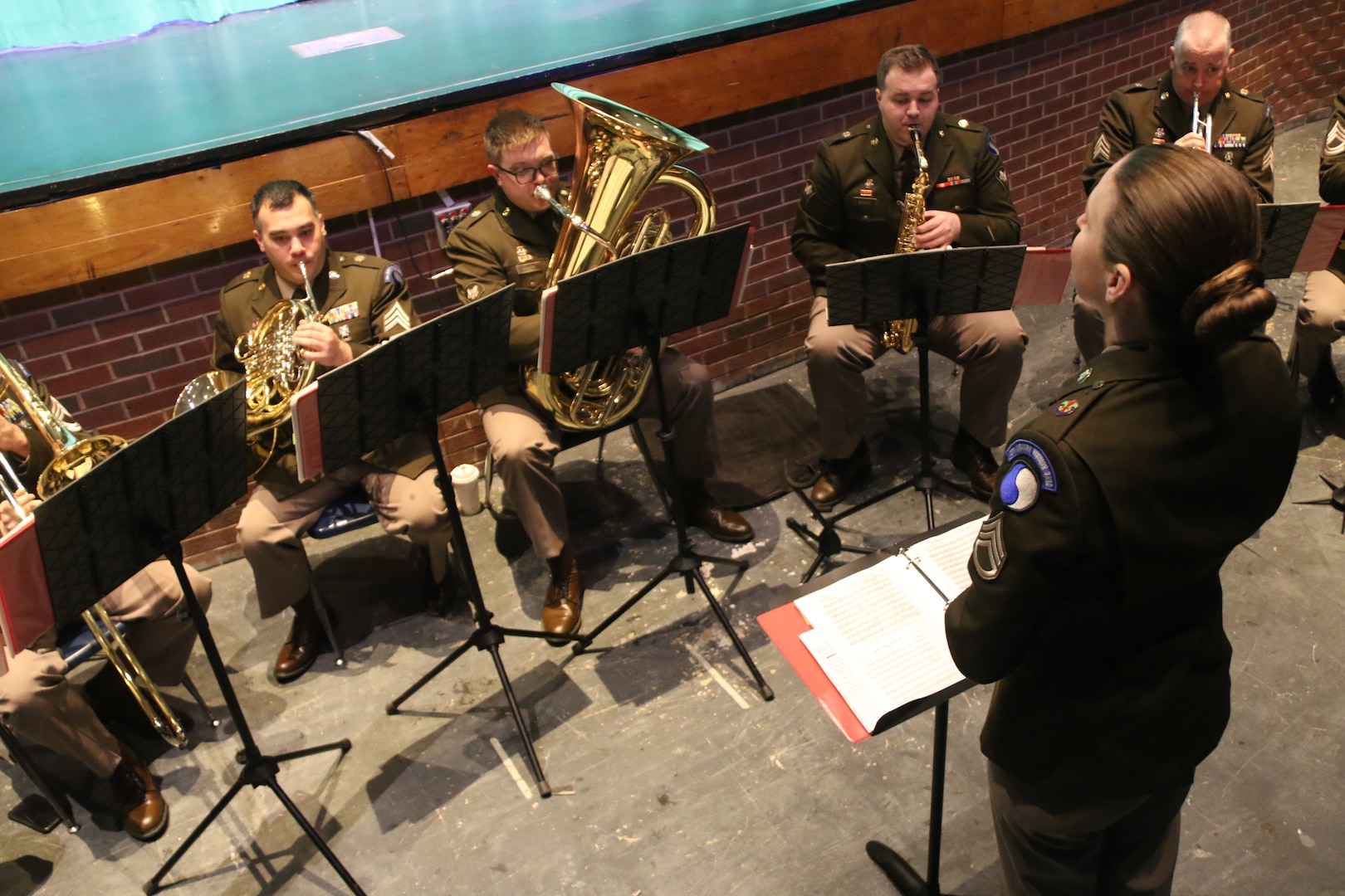 Soldier musicians performing in auditorium