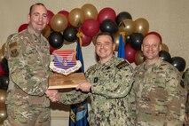 Joint Base Charleston personnel pose for a photo.