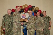 Joint Base Charleston personnel pose for a photo.