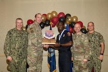 Joint Base Charleston personnel pose for a photo.