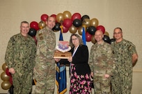 Joint Base Charleston personnel pose for a photo.