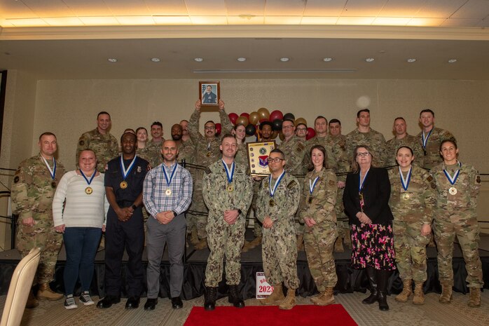 Joint Base Charleston personnel pose for a photo.