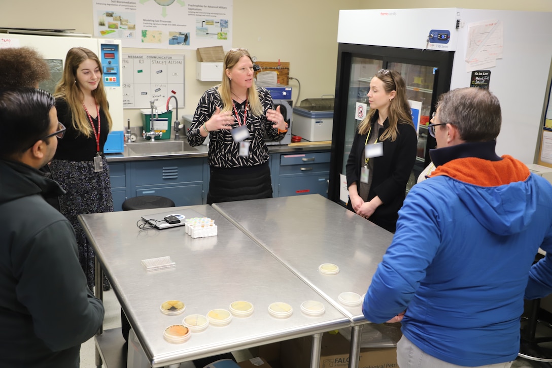 Dr. Robyn Barbato, ERDC's Cold Regions Research and Engineering Laboratory (CRREL) research microbiologist, shows Ice Control for cold Environments (ICE) program performer team members bacteria isolated from ERDC-CRREL's Permafrost Tunnel Research Facility in Fox, Alaska.