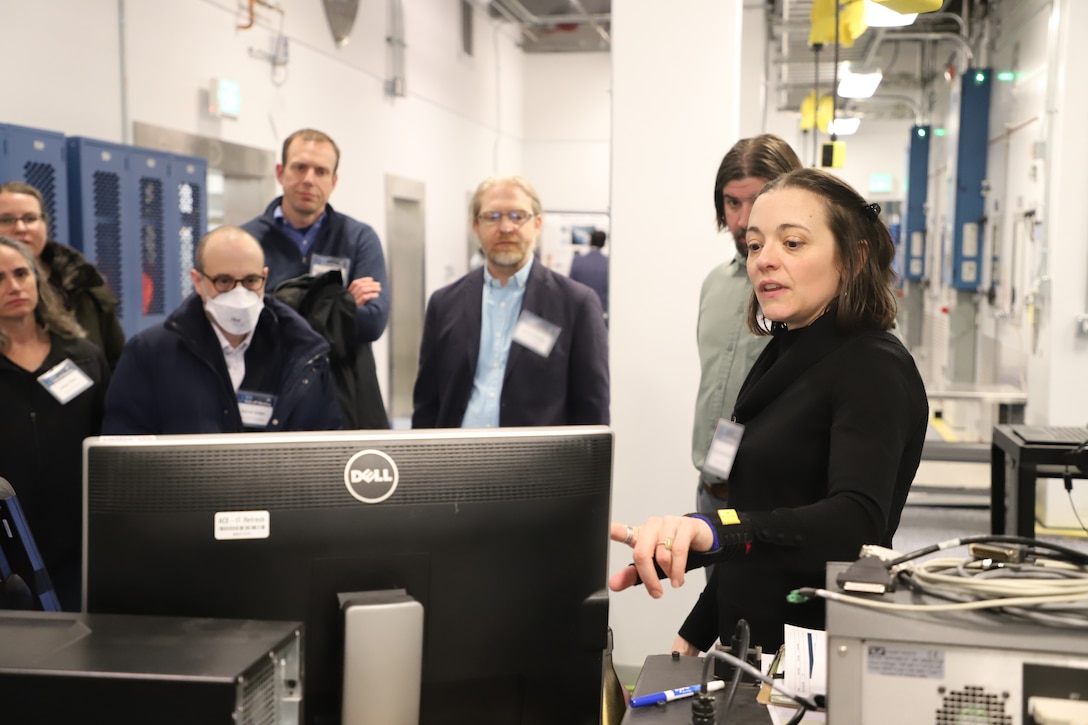 Dr. Emily Asenath-Smith, ERDC's Cold Regions Research and Engineering Laboratory (CRREL) research materials engineer, demonstrates CRREL laboratory capabilities to performer team members of the Ice Control for cold Environments (ICE) program.