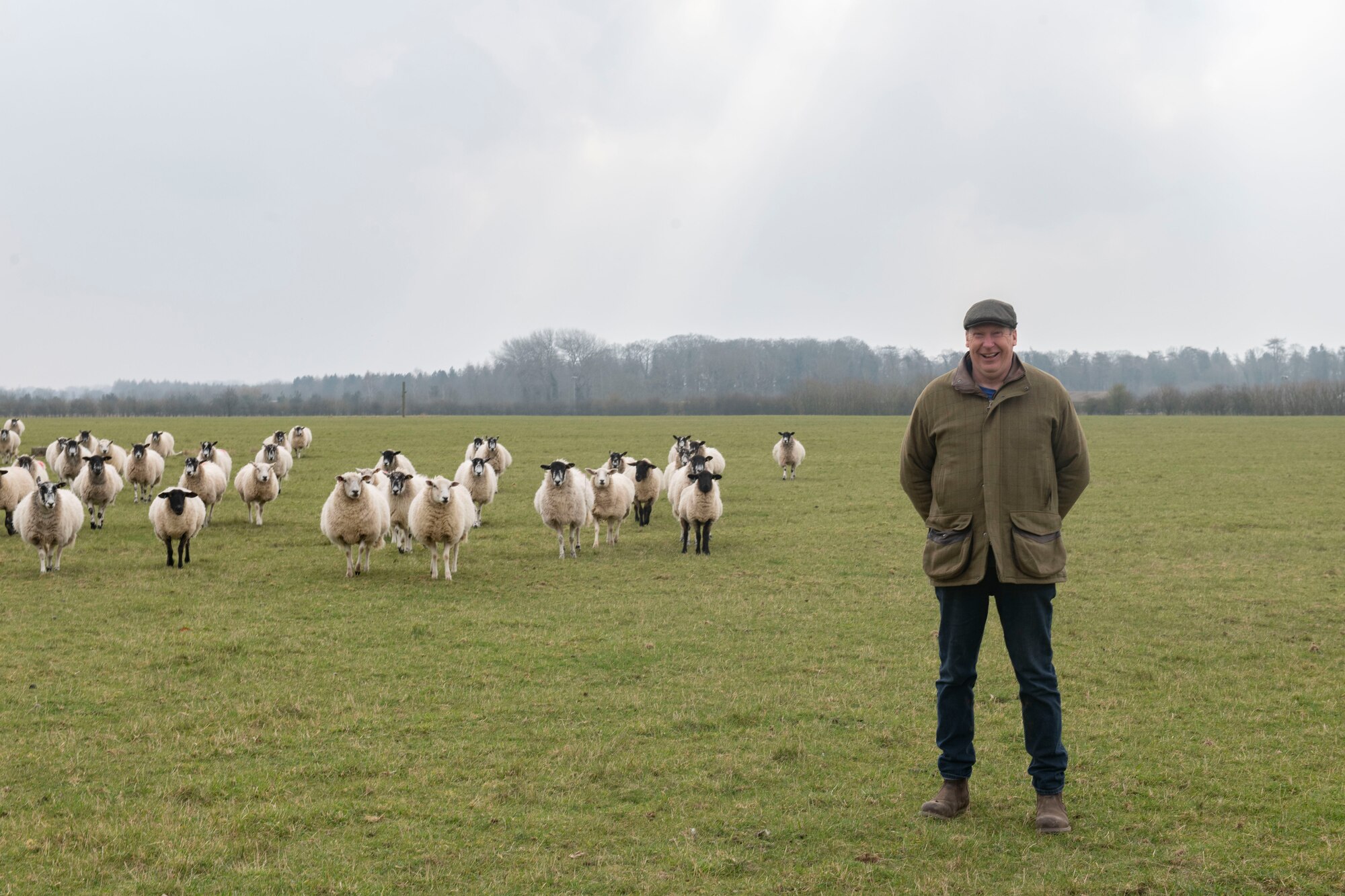 Robert Adams, farmer, poses for a photo with his sheep at RAF Croughton