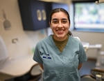 Airman Kinley Noel, a dental assistant assigned to the 59th Dental Squadron, poses for a photo at Dunn Dental Clinic, Joint Base San Antonio-Lackland, Texas, in honor of Dental Assistants Recognition Week, March 6, 2024.