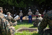 U.S. Marine Corps Sgt. Jesse Carter-Powell, center right, combat graphics specialist, Cpl. Sarah Grawcock, center left, a combat photographer and the mascot handler, both with Headquarters and Service Battalion, and Pfc. Bruno, the mascot of Marine Corps Recruit Depot San Diego and the Western Recruiting Region, speak to recruits at MCRD San Diego, California, March 8, 2024. The mascot's job is to boost morale, participate in outreach work, and attend events and ceremonies. (U.S. Marine Corps photo by Lance Cpl. Eric Valerio)