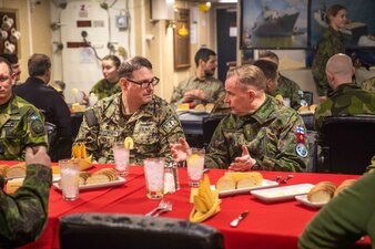 Cmdr. Christopher W. Van Loenen has dinner aboard USS Gunston Hall (LSD 44) with leaders of the Finnish and Swedish navy and marine corps during Steadfast Defender 24.