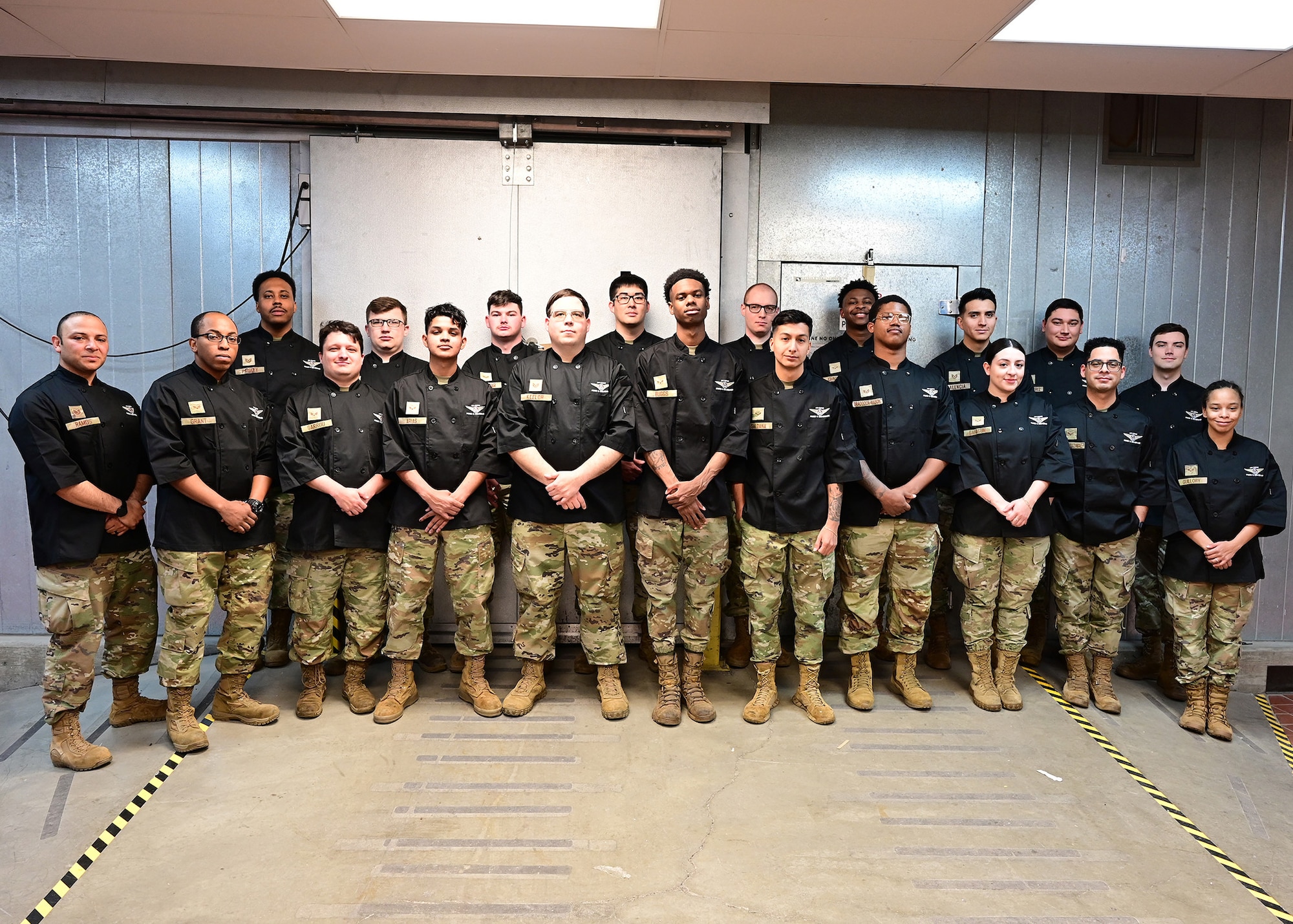 group photo of Missile Alert Facility Feeding Operations team, wearing food service tops and OCP pants.