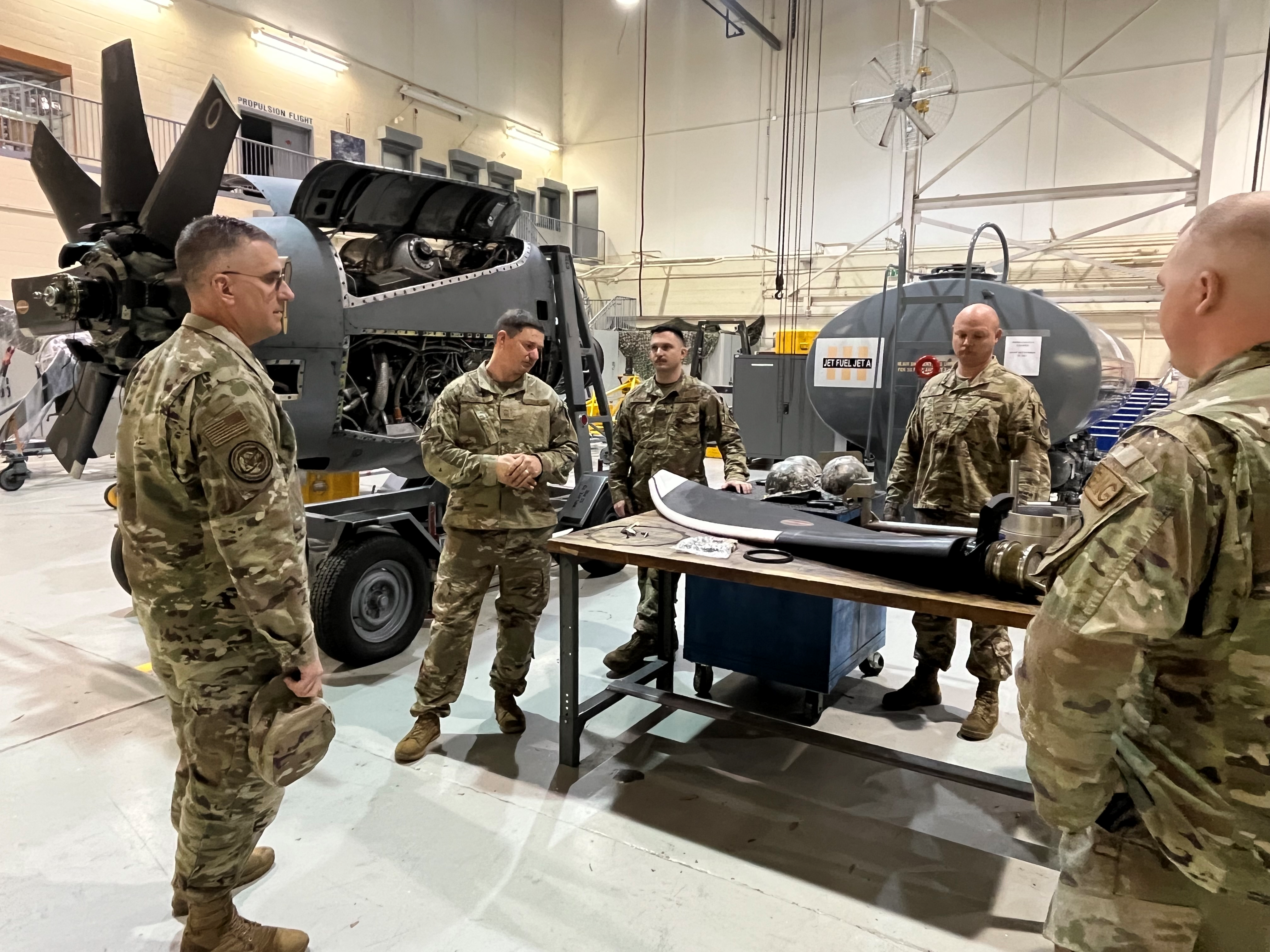 Brig. Gen. James Hartle, U.S. Air Force Associate Director of Logistics and Deputy Chief of Staff for Logistics, Engineering and Force Protection Directorate, left, listens as members from the 94th Maintenance Squadron brief him on the updated NP2000 aircraft propeller during a unit immersion visit March 1, 2024. The 94th Airlift Wing recently upgraded its C-130H aircraft propellers with the newer, more advanced NP2000 propeller, which decreases maintenance costs, reduces noise pollution, increases system reliability and bridges the gap to enable the legacy C-130H aircraft to better support future aircraft. (U.S. Air Force photo by Capt. Paris Krula)