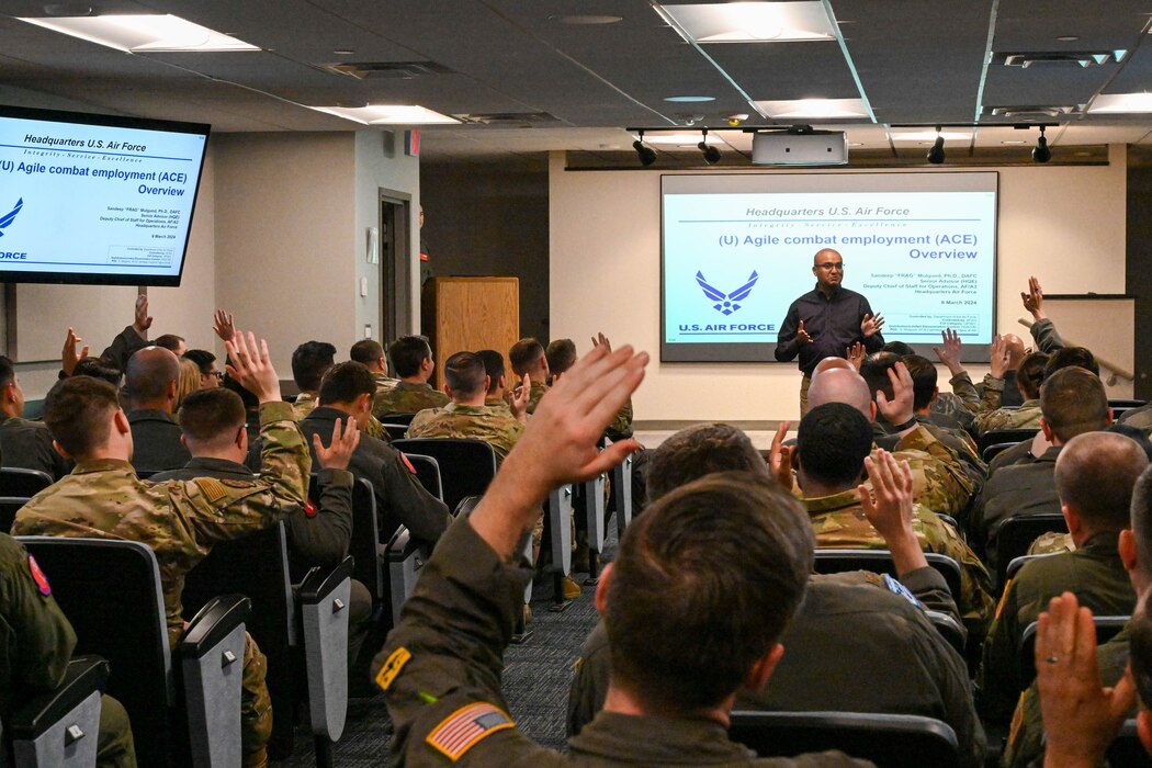 Dr. Sandeep Mulgund, Headquarters Air Force senior advisor to the deputy chief of staff for operations, delivers a brief about agile combat employment to the Airmen of the 97th Air Mobility Wing at Altus Air Force Base, Oklahoma, March 7, 2024. During Mulgund’s visit to both Joint Base San Antonio-Randolph and Altus, he discussed subjects within his areas of expertise, which include command and control, operations in the information environment, and agile combat employment. (U.S. Air Force photo by Senior Airman Miyah Gray)