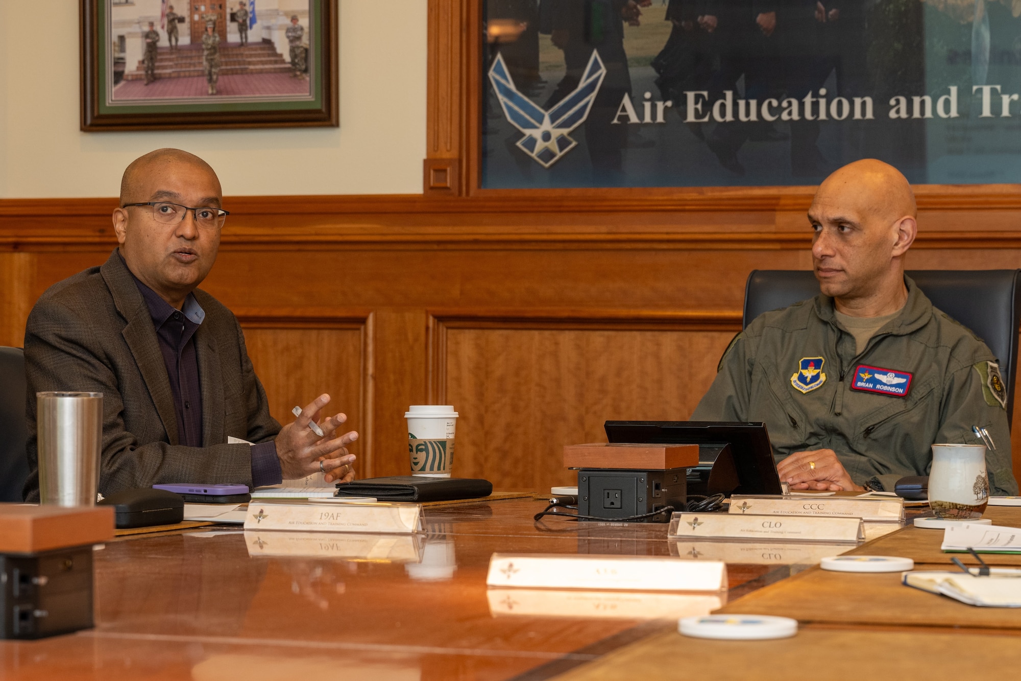 Dr. Sandeep Mulgund, Headquarters Air Force senior advisor to the deputy chief of staff for operations, speaks with U.S. Air Force Lt. Gen. Brian S. Robinson, commander of Air Education and Training Command, during a visit to AETC headquarters at Joint Base San Antonio-Randolph, Texas, March 7, 2024.