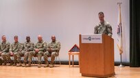 Capt. McCreery, Commander of the 933rd Military Police Company based in Fort Sheridan, speaks to the Soldiers and families of the 933rd on March 9th during a welcome home ceremony at the College of Lake County, in Grayslake, Illinois.