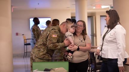 Soldiers and families with the 933rd Military Company came together March 9th for a welcome home ceremony at the College of Lake County, in Grayslake, Illinois.