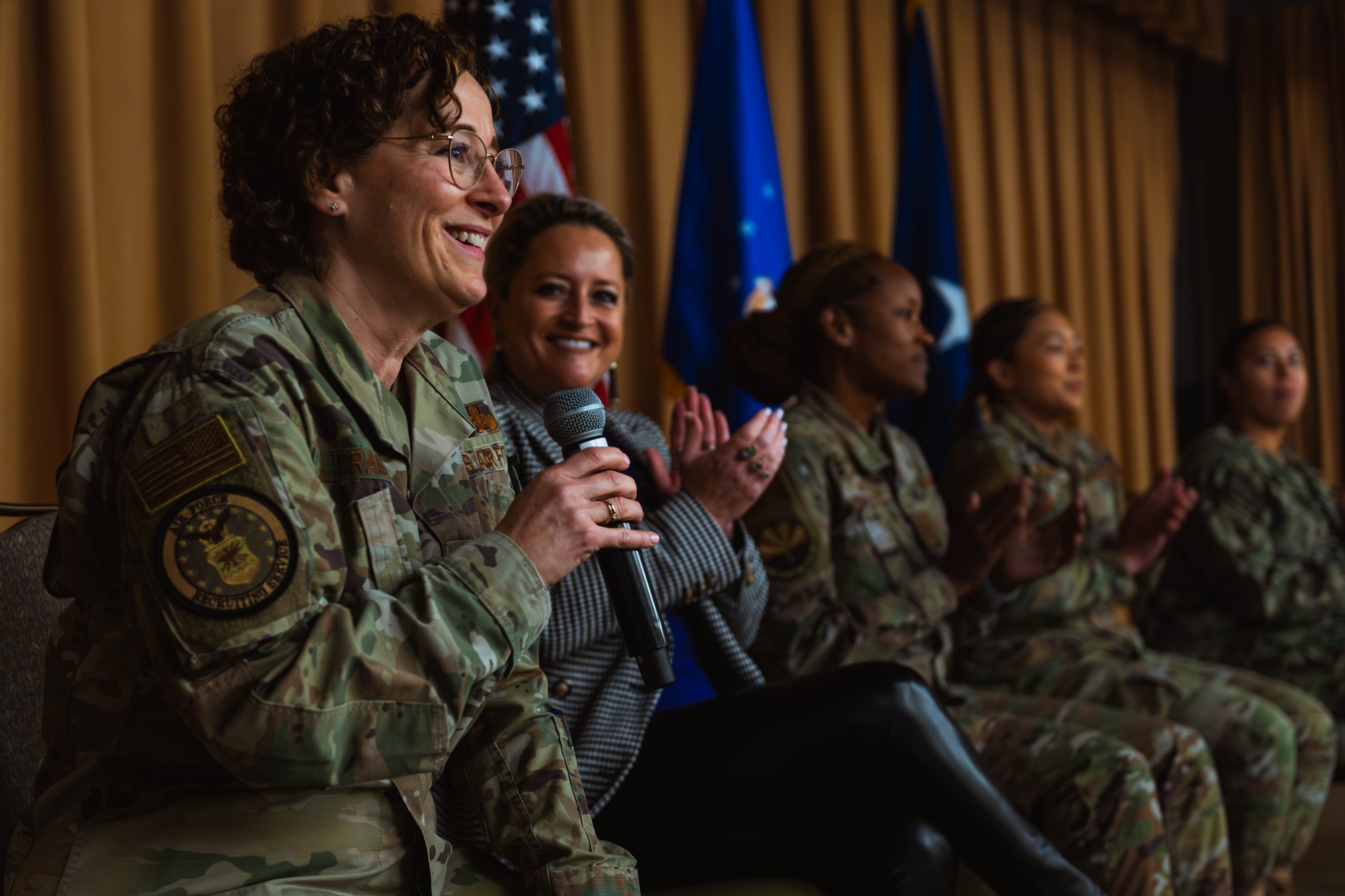 U.S. Air Force Brig. Gen. Lisa Craig, Air Force Recruiting Service deputy commander, speaks at the Women’s History Month exposition.