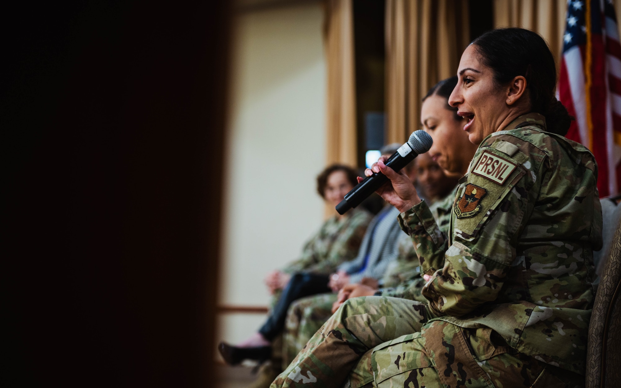 U.S. Air Force Airman 1st Class Ajin Howard, 56th Force Support Squadron career development technician, speaks at a Women’s History Month exposition.