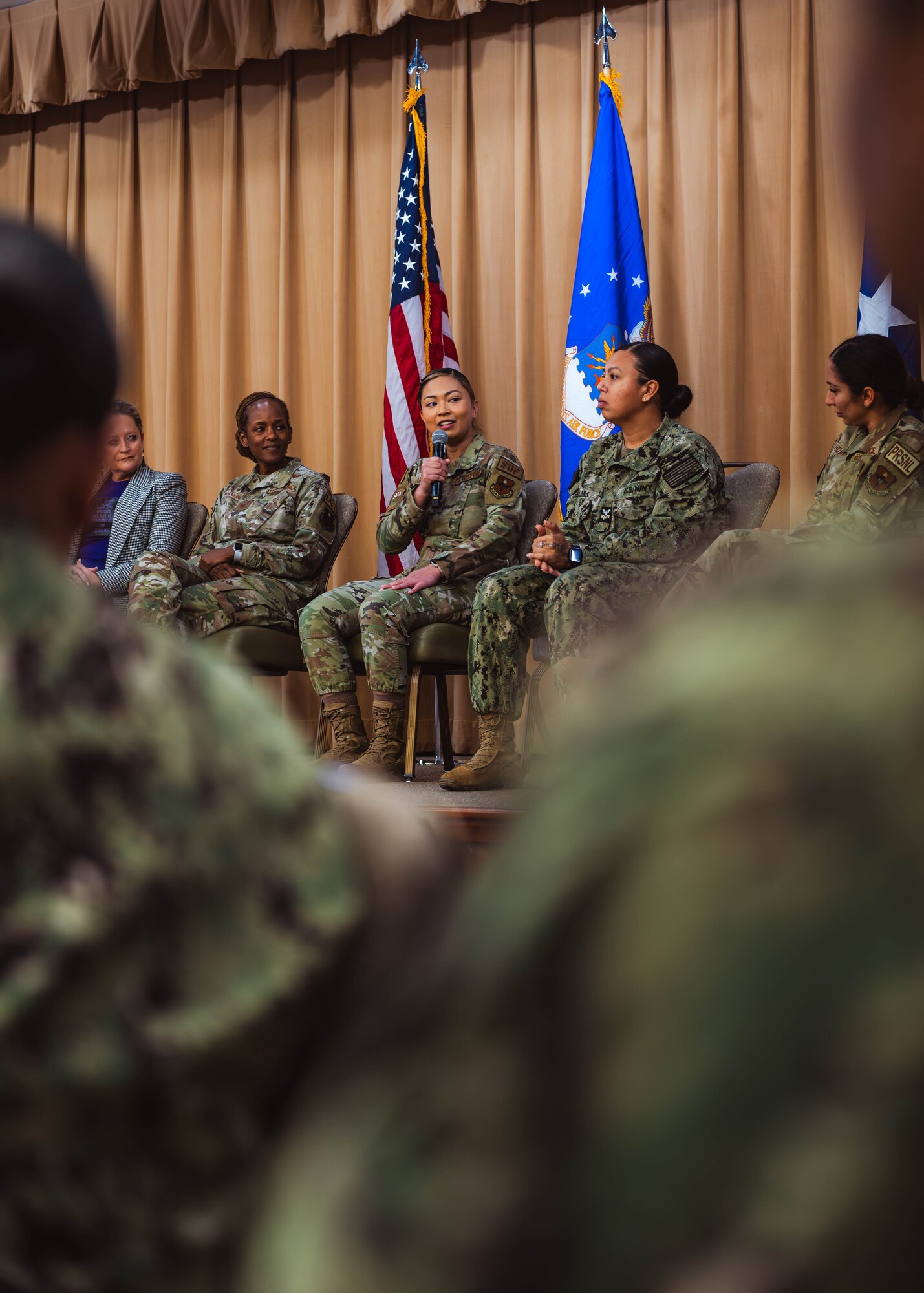 U.S. Air Force Staff Sergeant Julia Carrillo, 56th Logistics Readiness Squadron quality assurance evaluator, speaks at the Women’s History Month exposition.