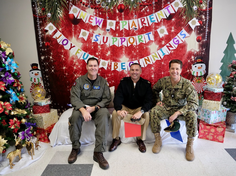 Pictured from left to right, NASL CO CAPT Shawn O'Connor, NASL CMC Joe Silveira, and NASL XO CDR Jeffry Findlay taking a break from their judging duties during the FFSC door decorating contest.