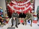 Pictured from left to right, NASL CO CAPT Shawn O'Connor, NASL CMC Joe Silveira, and NASL XO CDR Jeffry Findlay taking a break from their judging duties during the FFSC door decorating contest.