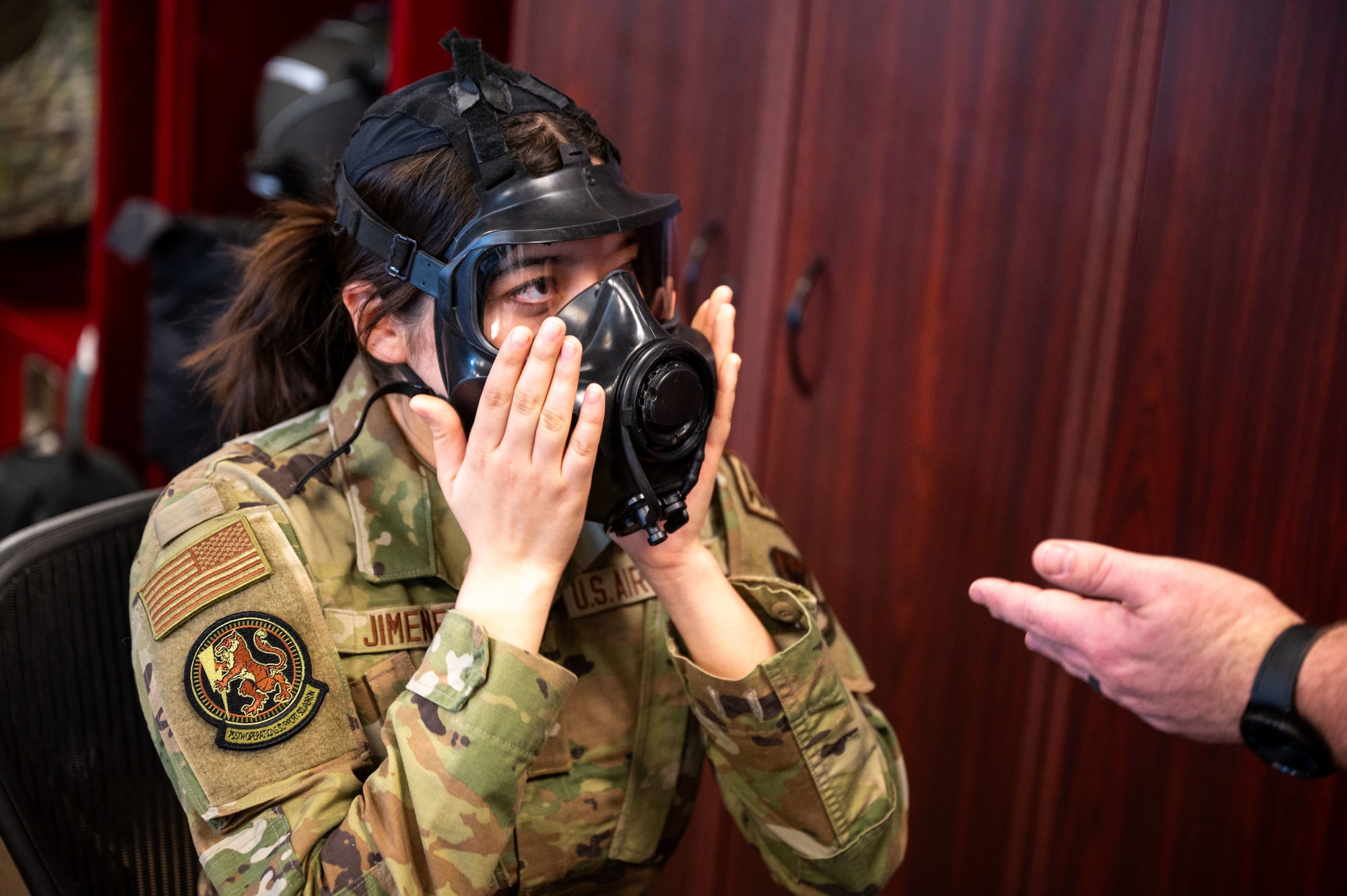 U.S. Air Force Airman Karina Jimenez, 755th Operations Support Squadron aircrew flight equipment specialist, trains with a M69 Joint Service Aircrew Mask Strategic Aircraft  respirator mask at Davis-Monthan Air Force Base, Ariz., March 5, 2024. Jimenez attended a new equipment training course featuring the M69 mask. (U.S. Air Force photo by Airman 1st Class Robert Allen Cooke III)