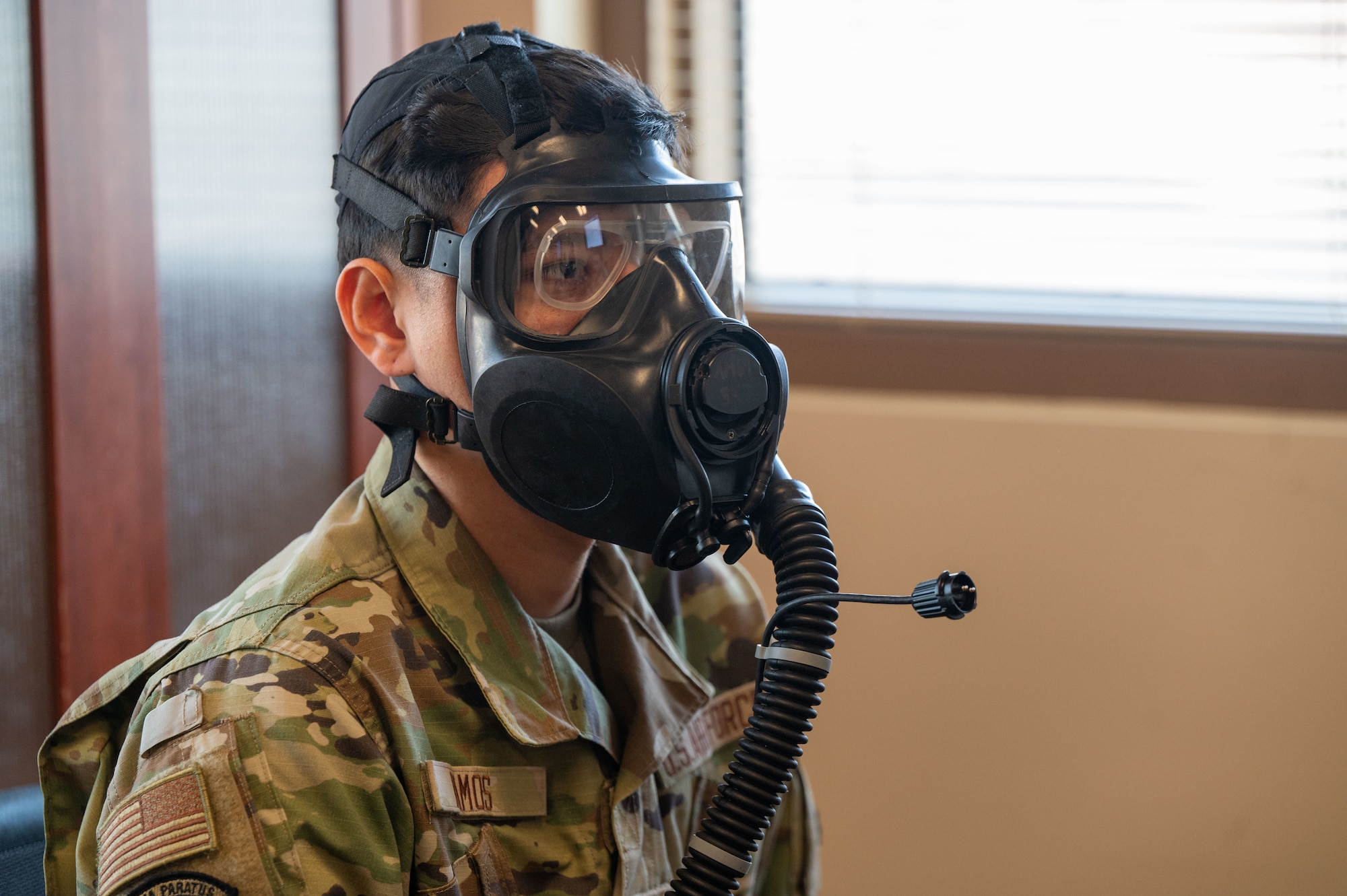 U.S. Air Force Airman 1st Class Alberto Ramos, 563rd Operations Support Squadron aircrew flight equipment specialist, wears a M69 Joint Service Aircrew Mask Strategic Aircraft respirator mask at Davis-Monthan Air Force Base, Ariz., March 5, 2024. Ramos attended a new equipment training course featuring the M69 respirator mask. (U.S. Air Force photo by Airman 1st Class Robert Allen Cooke III)