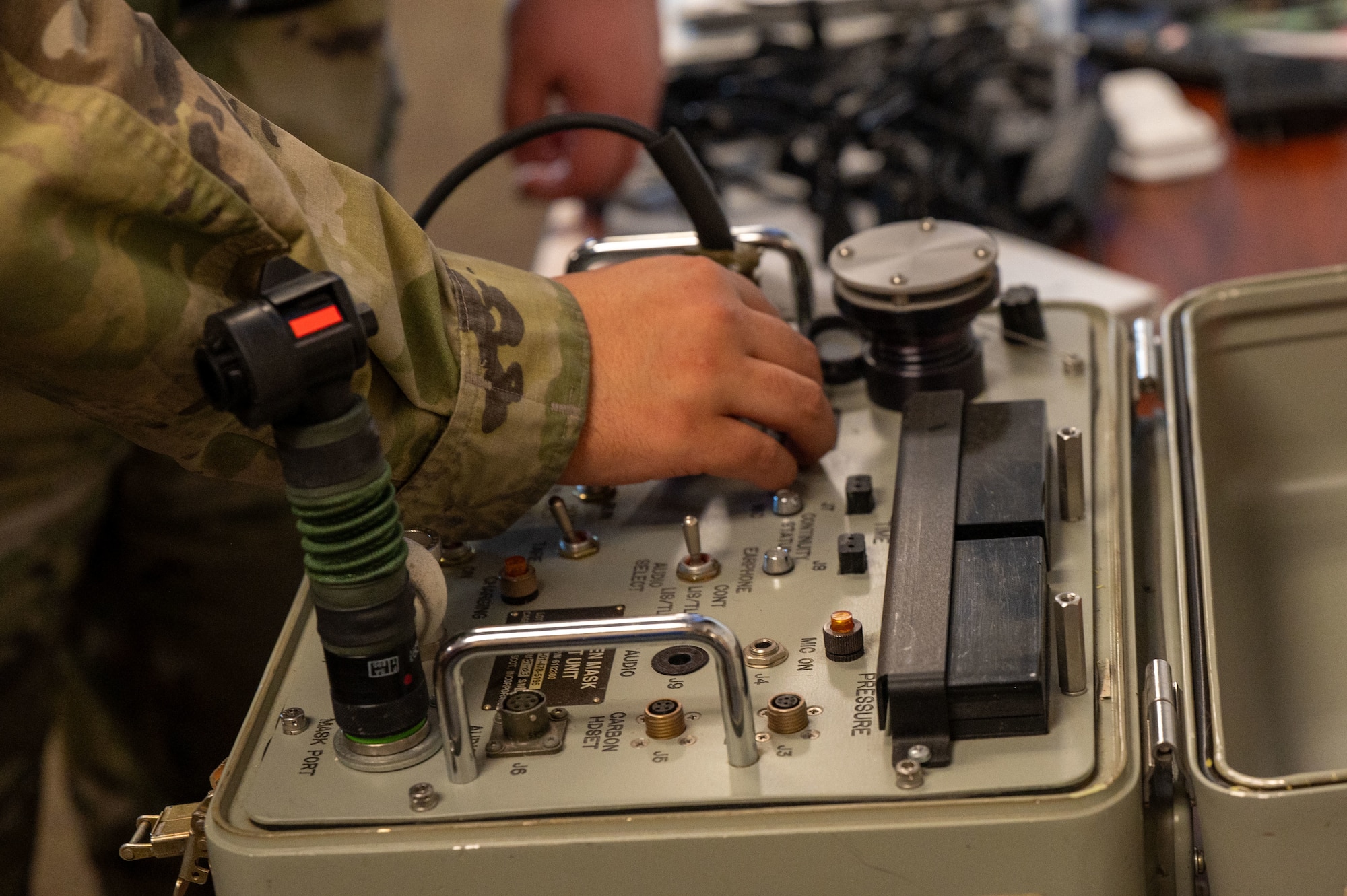 U.S. Air Force Airman 1st Class Melodee Arevalo, 755th Operations Support Squadron aircrew flight equipment specialist, uses a system communication and oxygen tester at Davis-Monthan Air Force Base, Ariz., March 5, 2024. The SCOT was designed to test the efficiency of life support equipment, such as the M69 mask. (U.S. Air Force photo by Airman 1st Class Robert Allen Cooke III)