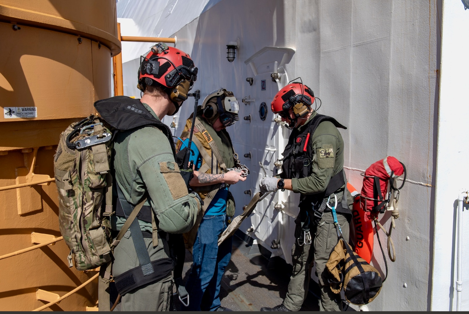 On March 6, 2024, the U.S. Coast Guard and U.S. Navy's Helicopter Sea Combat Squadron 25 (HSC-25) effectively evacuated a U.S. Coast Guard member from the USCGC Polar Star (WAGB 10), 100 nautical miles south of Guam, in a joint effort.  The incident began on March 5, when the Joint Rescue Sub-Center (JRSC) Guam received a communication from the Polar Star crew regarding a 43-year-old man aboard experiencing severe abdominal pain. Recognizing the need for urgent medical attention beyond the capabilities available on ship, watchstanders directed the cutter to reroute closer to Guam and initiate a medical evacuation. (U.S. Coast Guard photo by Petty Officer 2nd Class Ryan Graves)