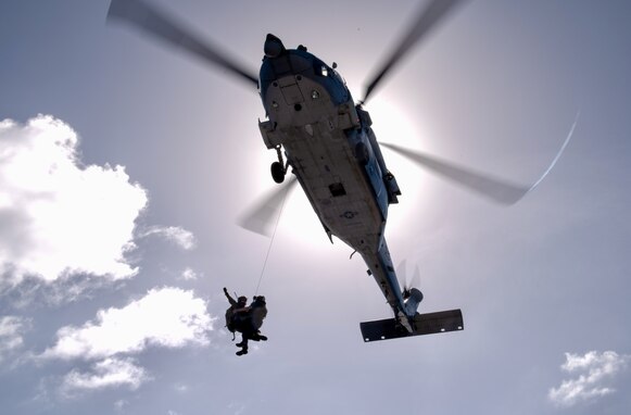 On March 6, 2024, the U.S. Coast Guard and U.S. Navy's Helicopter Sea Combat Squadron 25 (HSC-25) effectively evacuated a U.S. Coast Guard member from the USCGC Polar Star (WAGB 10), 100 nautical miles south of Guam, in a joint effort.  The incident began on March 5, when the Joint Rescue Sub-Center (JRSC) Guam received a communication from the Polar Star crew regarding a 43-year-old man aboard experiencing severe abdominal pain. Recognizing the need for urgent medical attention beyond the capabilities available on ship, watchstanders directed the cutter to reroute closer to Guam and initiate a medical evacuation. (U.S. Coast Guard photo by Petty Officer 2nd Class Ryan Graves)