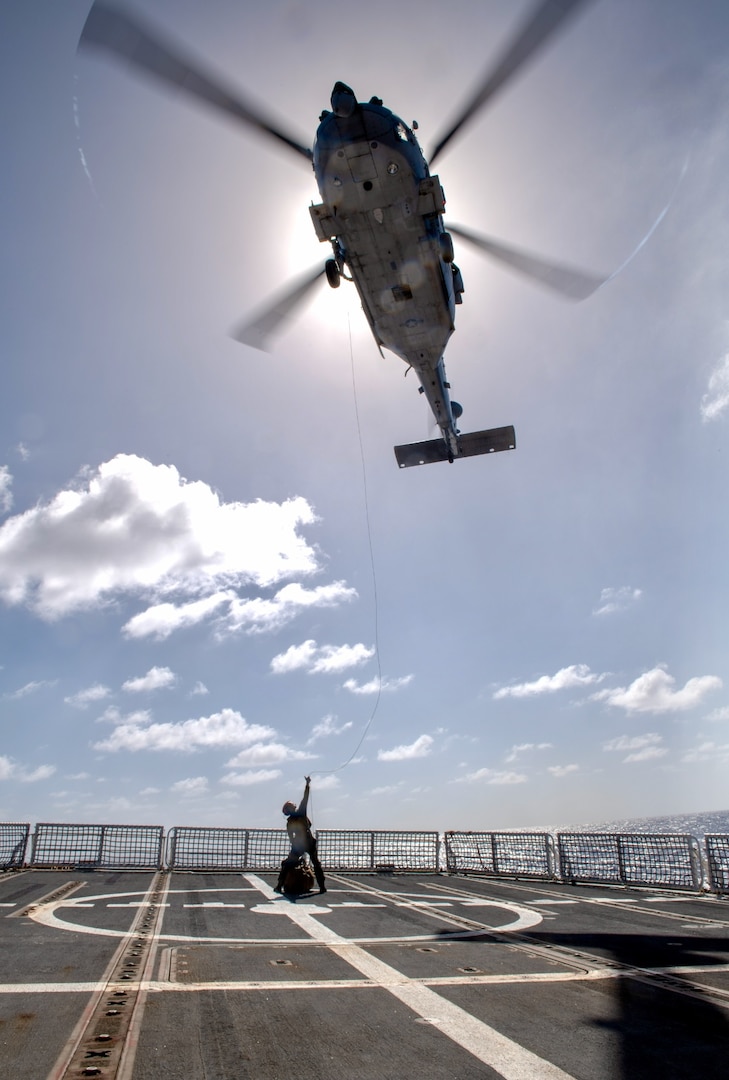 On March 6, 2024, the U.S. Coast Guard and U.S. Navy's Helicopter Sea Combat Squadron 25 (HSC-25) effectively evacuated a U.S. Coast Guard member from the USCGC Polar Star (WAGB 10), 100 nautical miles south of Guam, in a joint effort.  The incident began on March 5, when the Joint Rescue Sub-Center (JRSC) Guam received a communication from the Polar Star crew regarding a 43-year-old man aboard experiencing severe abdominal pain. Recognizing the need for urgent medical attention beyond the capabilities available on ship, watchstanders directed the cutter to reroute closer to Guam and initiate a medical evacuation. (U.S. Coast Guard photo by Petty Officer 2nd Class Ryan Graves)