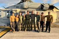 The crew of a U.S. Navy Helicopter Sea Combat Squadron 25 (HSC-25) MH-60S Knighthawk helicopter stand for a photo on March 6, 2024, at Andersen Air Force Bse after effectively evacuated a U.S. Coast Guard member from the USCGC Polar Star (WAGB 10), 100 nautical miles south of Guam, in a joint effort. The incident began on March 5, when the Joint Rescue Sub-Center (JRSC) Guam received a communication from the Polar Star crew regarding a 43-year-old man aboard experiencing severe abdominal pain. Recognizing the need for urgent medical attention beyond the capabilities available on ship, watchstanders directed the cutter to reroute closer to Guam and initiate a medical evacuation. (U.S. Navy photo by Petty Officer 2nd Class Matthew Thomas)



SAR, JRSC, Guam, medevac, HSC-25
