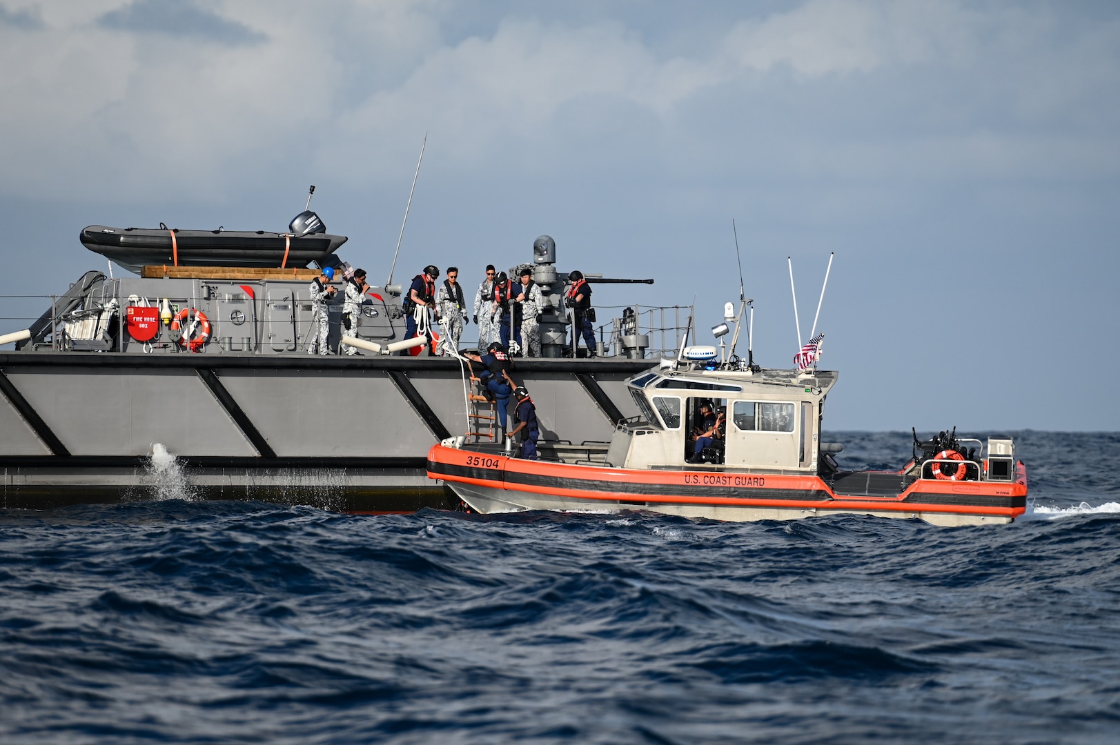 A long-range intercept boat from U.S. Coast Guard Cutter Bertholf (WMSL 750) approaches a Republic of Singapore Navy vessel during a boarding exercise conducted off the coast of Singapore, Feb. 29, 2024. The boarding exercise provided members from both services an opportunity to collaborate on best practices for at-sea evolutions. (U.S. Coast Guard photo by Petty Officer Steve Strohmaier)
